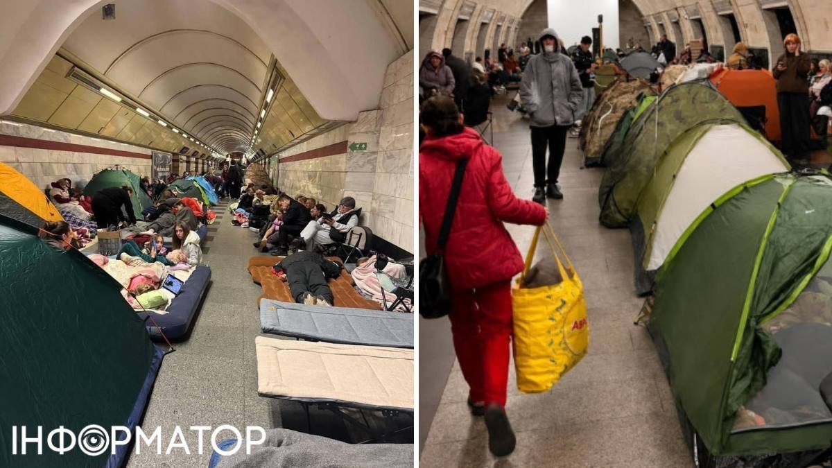 Натовп людей на платформі Київського метрополітену під час повітряної тривоги, де помітні намети